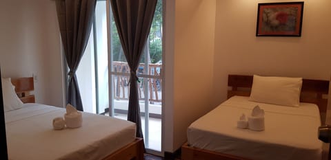 Deluxe Room, 1 Bedroom, Partial Sea View | In-room safe, free WiFi, bed sheets