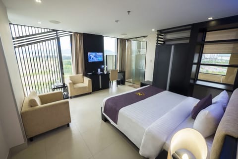 Suite, 1 Double Bed, Sea View | Minibar, in-room safe, desk, laptop workspace