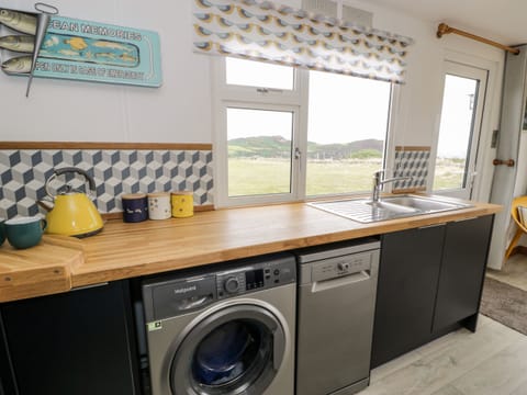 Fridge, dishwasher, electric kettle, cookware/dishes/utensils