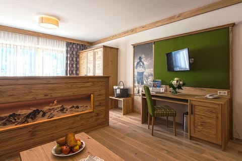 Deluxe Double Room, Balcony, Mountain View (Graukogel) | Living area | 43-inch flat-screen TV with cable channels, TV