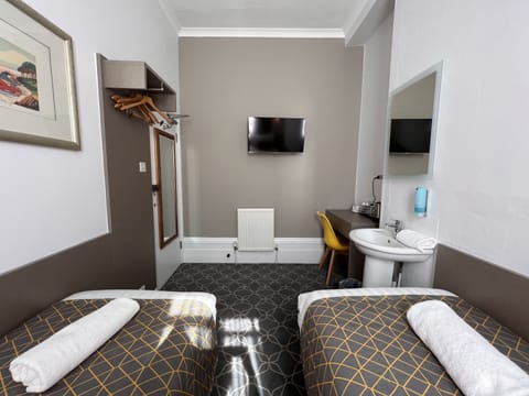 Basic Twin Room, Shared Bathroom | Premium bedding, Select Comfort beds, desk, laptop workspace