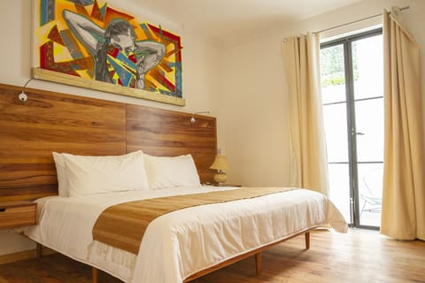 Deluxe Room, 1 King Bed | In-room safe, individually decorated, individually furnished