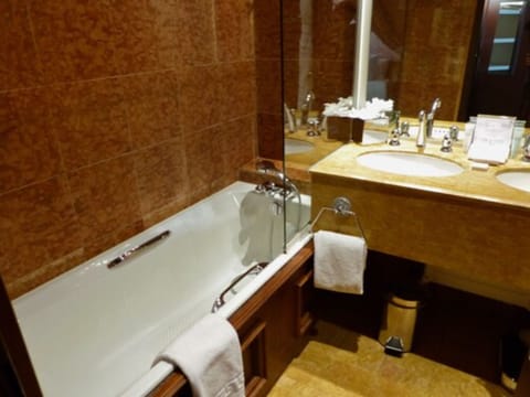 Suite | Bathroom | Deep soaking tub, designer toiletries, hair dryer, bathrobes