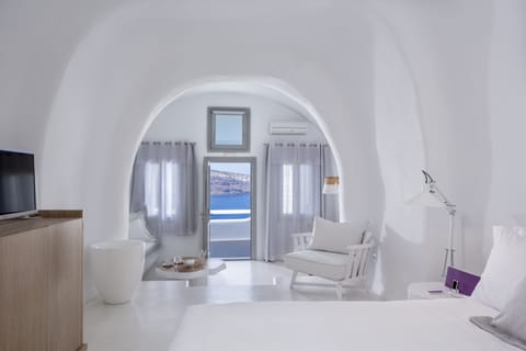 Senior Suite, Sea View | Living area | 24-inch flat-screen TV with satellite channels, TV, iPod dock