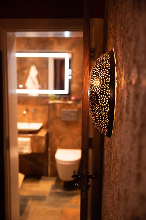 MoMarra Suite | Bathroom | Shower, rainfall showerhead, designer toiletries, hair dryer