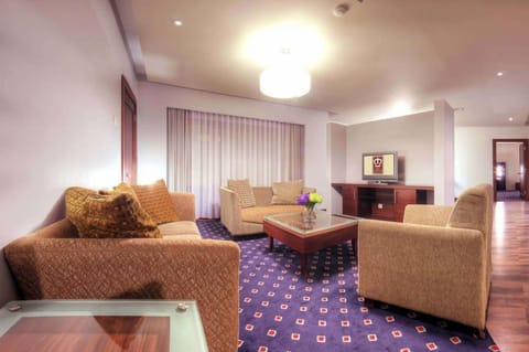 Junior Double Room | Living room | Flat-screen TV