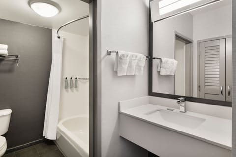 Room, 2 Queen Beds | Bathroom | Combined shower/tub, free toiletries, hair dryer, towels