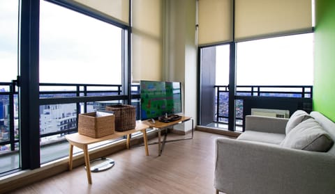 Business Apartment, 1 Bedroom, Balcony, City View | Living area | 50-inch Smart TV with digital channels, TV, fireplace