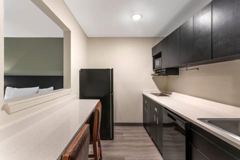 Suite, 2 Queen Beds, Non Smoking (Efficiency) | Private kitchen | Full-size fridge, microwave, oven, stovetop