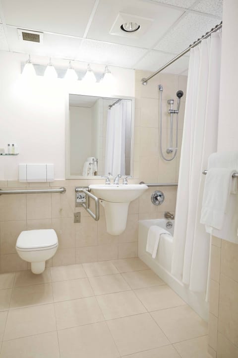 Combined shower/tub, designer toiletries, hair dryer, towels