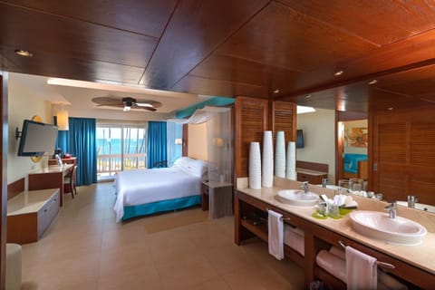 Premium Suite, Oceanfront (Level) | Bathroom | Combined shower/tub, free toiletries, hair dryer, bathrobes