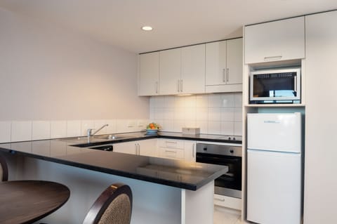 Spencer One-Bedroom Suite | Private kitchen | Microwave, coffee/tea maker, electric kettle