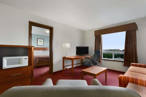 Suite, 1 Bedroom, Non Smoking | Desk, laptop workspace, blackout drapes, iron/ironing board