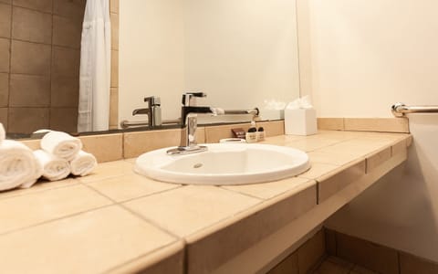 Deluxe Room, 2 Queen Beds | Bathroom | Shower, hair dryer, towels, soap