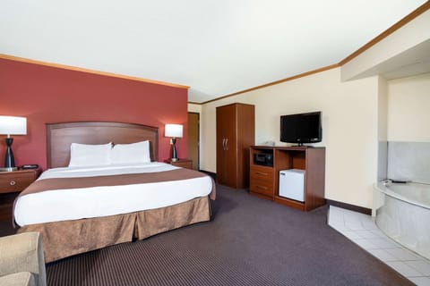 Superior Suite, 1 King Bed, Non Smoking | Desk, laptop workspace, blackout drapes, iron/ironing board