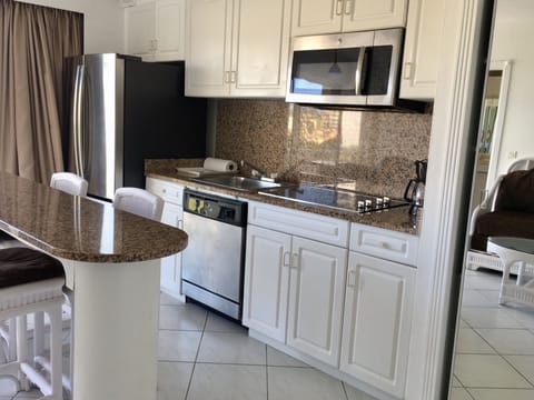 Superior Suite, 1 Bedroom, Lagoon View | Private kitchen | Fridge, microwave, stovetop, dishwasher