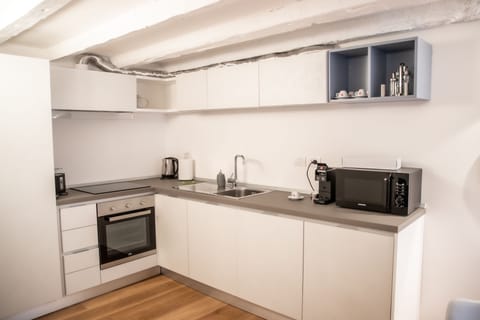 City Lodge | Private kitchen | Fridge, microwave, oven, stovetop