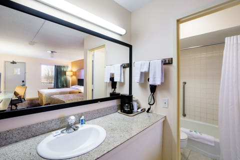 Standard Room, 2 Queen Beds, Non Smoking | Bathroom | Combined shower/tub, hair dryer, towels