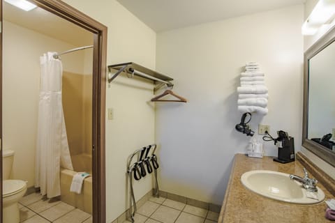 Standard Room, 2 Queen Beds | Bathroom | Combined shower/tub, hair dryer, towels, shampoo