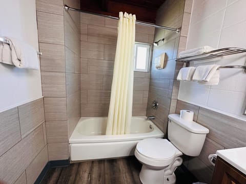 Standard Suite, 1 King Bed, Kitchenette | Bathroom | Free toiletries, hair dryer, towels