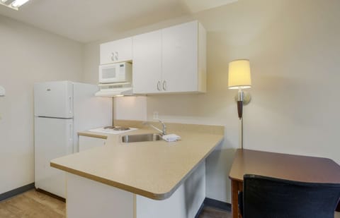 Studio, 1 Queen Bed, Non Smoking | Private kitchen | Full-size fridge, microwave, stovetop, coffee/tea maker