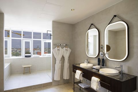 Suite, 1 King Bed (Duplex) | Bathroom | Shower, designer toiletries, hair dryer, slippers