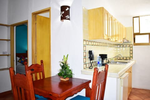 Two Bedroom Suite Pool View | Private kitchenette | Cookware/dishes/utensils