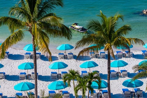 On the beach, white sand, beach towels, kayaking