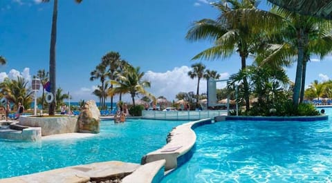 14 outdoor pools, open 8:00 AM to 11:00 PM, free cabanas, pool umbrellas