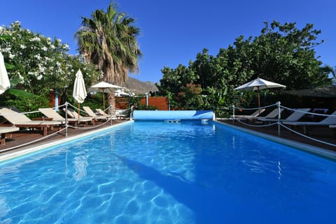 Outdoor pool, open 8 AM to 8:30 PM, pool umbrellas, sun loungers