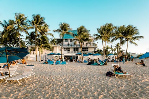 On the beach, sun loungers, beach umbrellas, beach towels