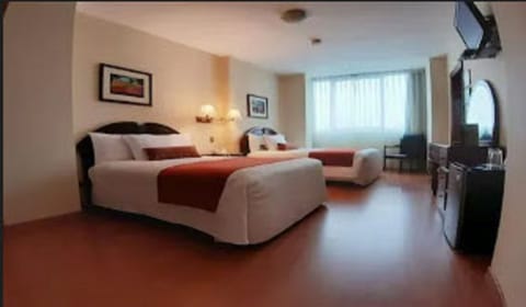 Deluxe Double Room | Minibar, in-room safe, iron/ironing board, free cribs/infant beds