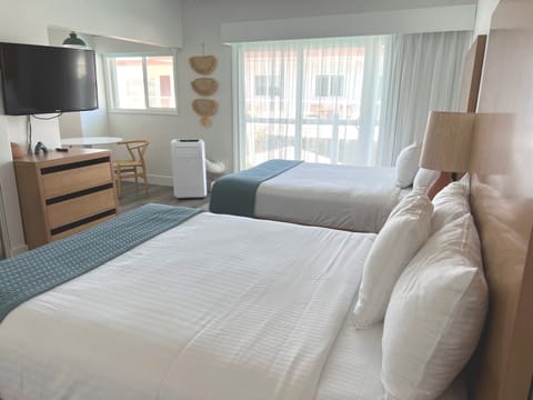 Standard Room, 2 Queen Beds, Pool View | In-room safe, iron/ironing board, travel crib, free WiFi