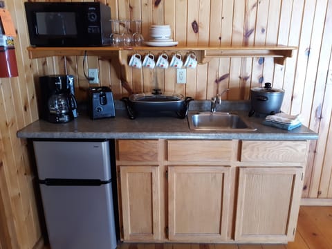 Microwave, toaster, cookware/dishes/utensils, dining tables