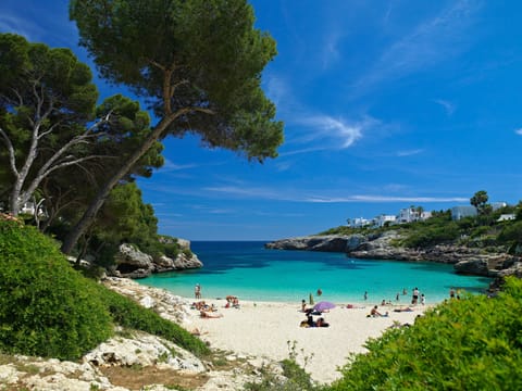 Beach nearby, white sand, sun loungers, beach umbrellas