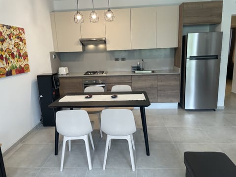 Comfort Apartment | Private kitchen | Full-size fridge, oven, stovetop, toaster