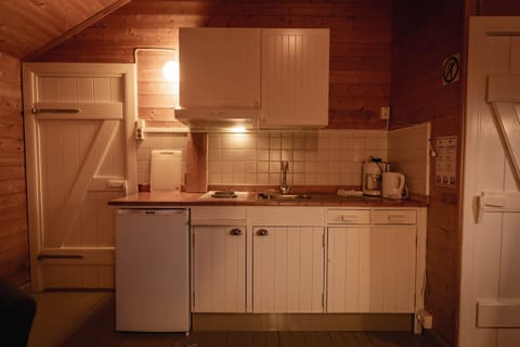 1-bedroom + open loft Standard Rorbu Cabin | Private kitchen | Fridge, stovetop, coffee/tea maker, electric kettle