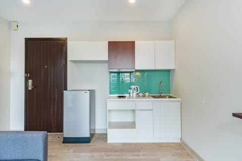 Triple Room, Multiple Beds, Pool View | Living area | 40-inch Smart TV with cable channels, printers