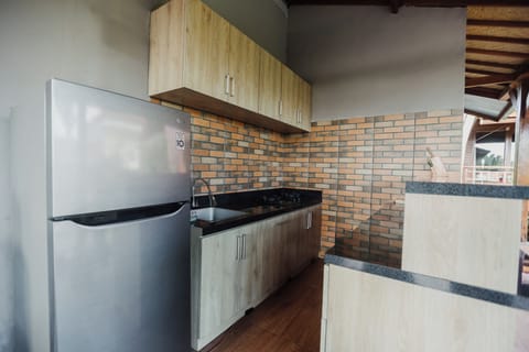 Deluxe Double Room, Pool View | Shared kitchen | Full-size fridge, microwave, cookware/dishes/utensils