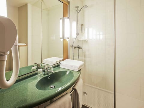 Premium bedding, desk, laptop workspace, blackout drapes