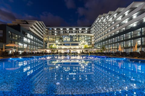 Indoor pool, outdoor pool, pool umbrellas, sun loungers