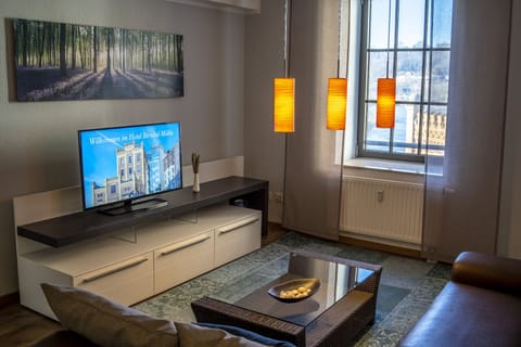 Premium Suite | Living area | 50-cm flat-screen TV with cable channels, TV