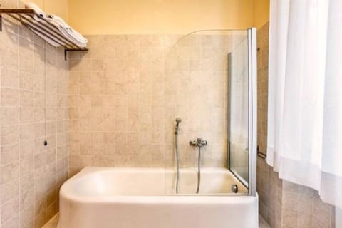 Suite, 2 Double Beds | Bathroom | Free toiletries, hair dryer, bidet, towels