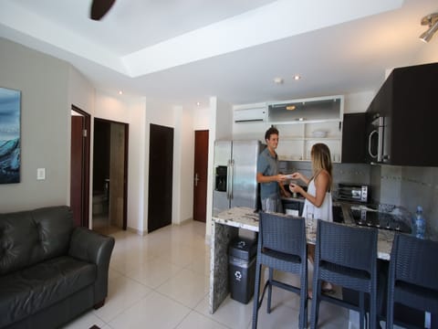 1BR KITCHEN SUITE W/Kitchen, Living room, 2 balconies | Private kitchen | Coffee/tea maker, highchair, eco-friendly cleaning products