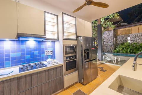 Villa | Private kitchen | Fridge, microwave, oven, stovetop