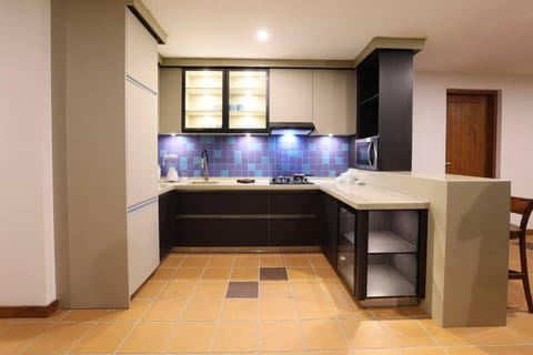 Villa | Private kitchen | Fridge, microwave, oven, stovetop