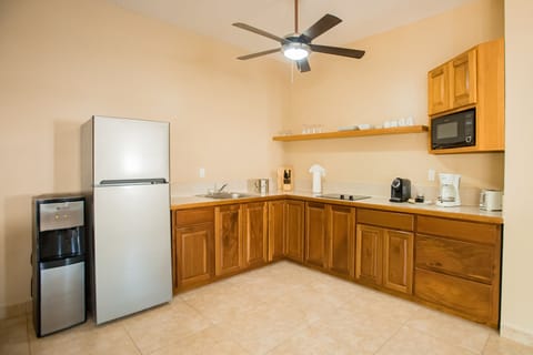 Junior Suite | Private kitchen | Full-size fridge, microwave, stovetop, coffee/tea maker