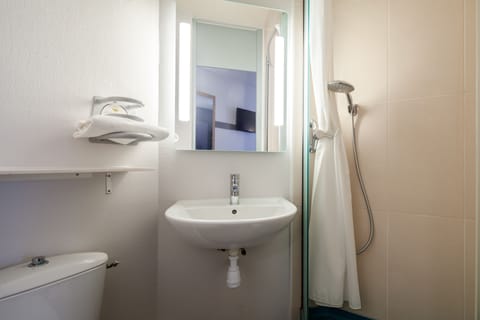 Shower, free toiletries, hair dryer, towels