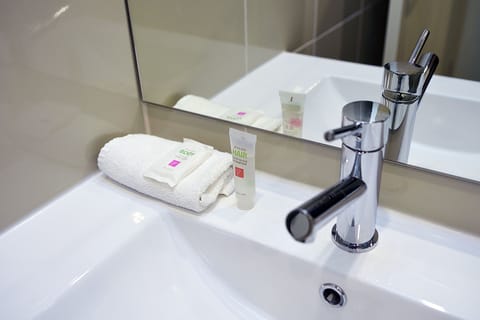 Shower, eco-friendly toiletries, hair dryer, towels