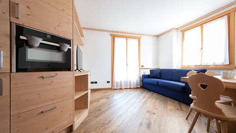 Apartment (1 Bedroom) | Living area | 55-inch flat-screen TV with cable channels, TV